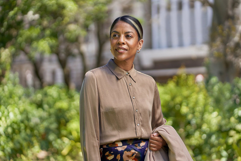 Professional woman standing outside an office building